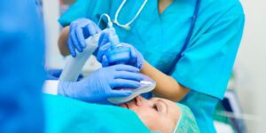 Anesthesiologist working on a patient in OR